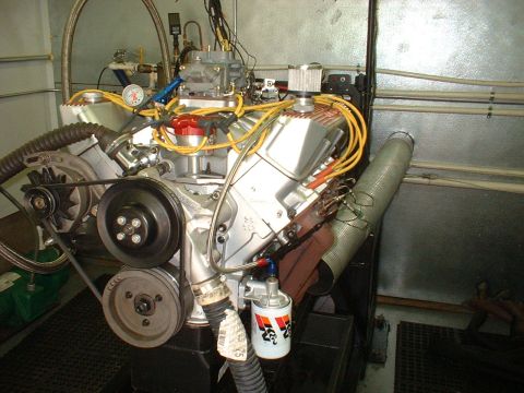 1969 Mercury Cyclone - A V8 engine is set up on a test stand, complete with a carburetor and exhaust system.
