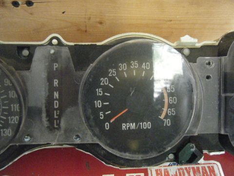 1991 Nissan Micra - Close-up of a car's instrument cluster showing various gauges and indicators.