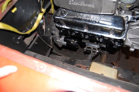1994 Ford Bronco - Engine starter motor and chrome valve cover detail. No year is visible.