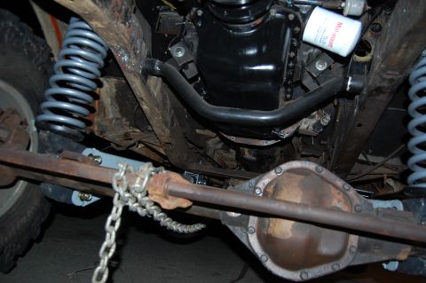 1994 Ford Bronco - This photo shows the undercarriage of a vehicle, focusing on the rear axle and suspension components.