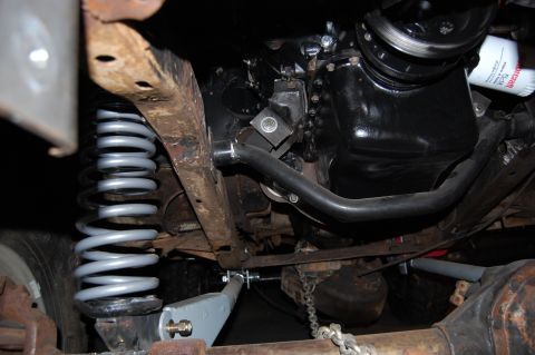 1994 Ford Bronco - Underbody view of a 1994 Ford Bronco, highlighting the suspension system and engine oil pan.