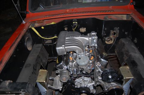 1994 Ford Bronco - Engine bay view of a V8 engine, likely a Ford Mustang engine swap, with custom intake.