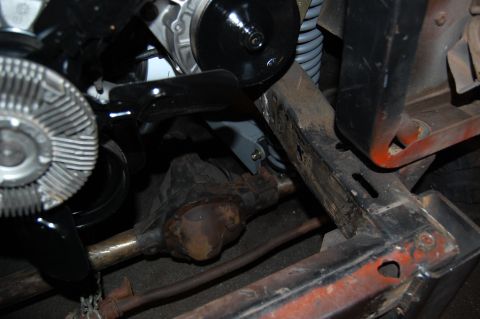 1994 Ford Bronco - Close-up view of engine and chassis parts, including a differential and fan.