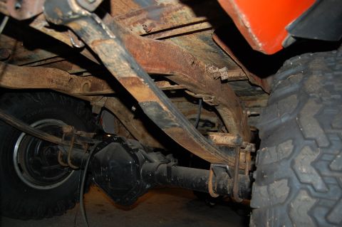 1994 Ford Bronco - Close-up view of the undercarriage, showing the leaf spring suspension and rear axle assembly.