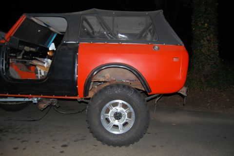 1994 Ford Bronco - This International Harvester Scout II is shown from the side, with its doors removed and a black soft top.