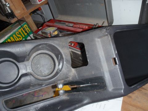 1996 Ford Bronco - hole cut into console for wires/clearence.