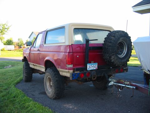 1989 Ford Bronco - Drivers rear corner shot. Rear bumper has swing away tire carrier and hitch.