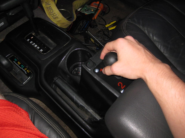 This shows teh drivers arm at rest, easily positioned to shift the gears