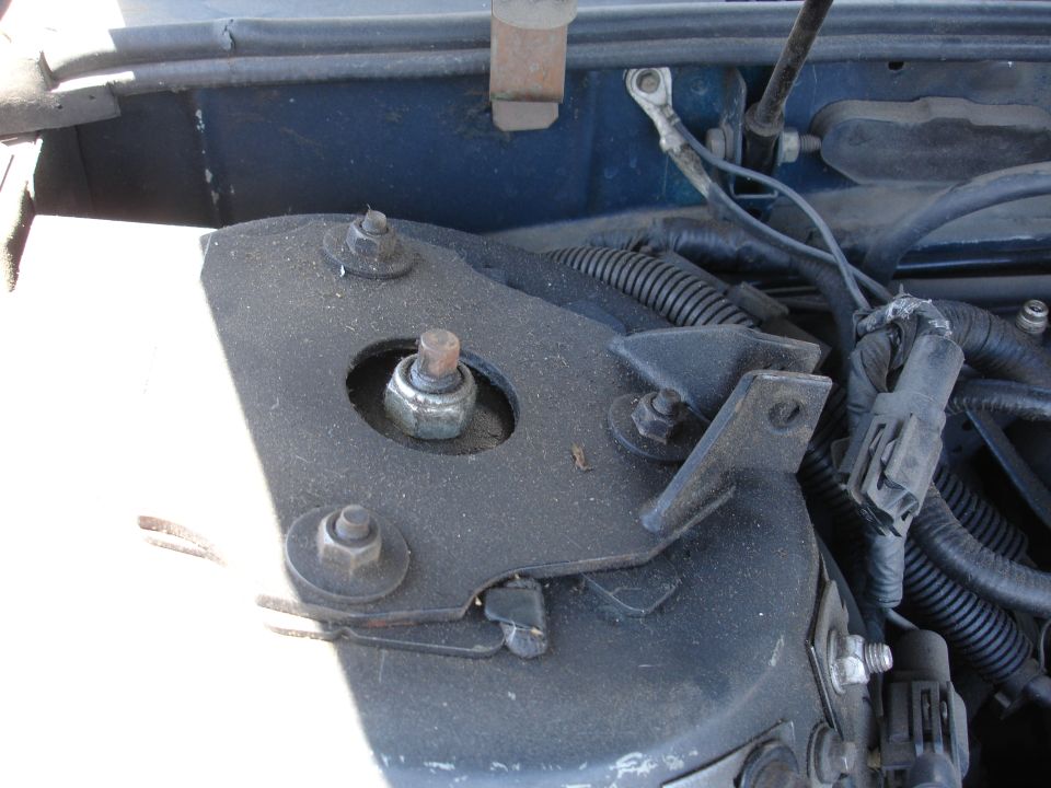 Engine bay strut mount with bolts and wiring harness