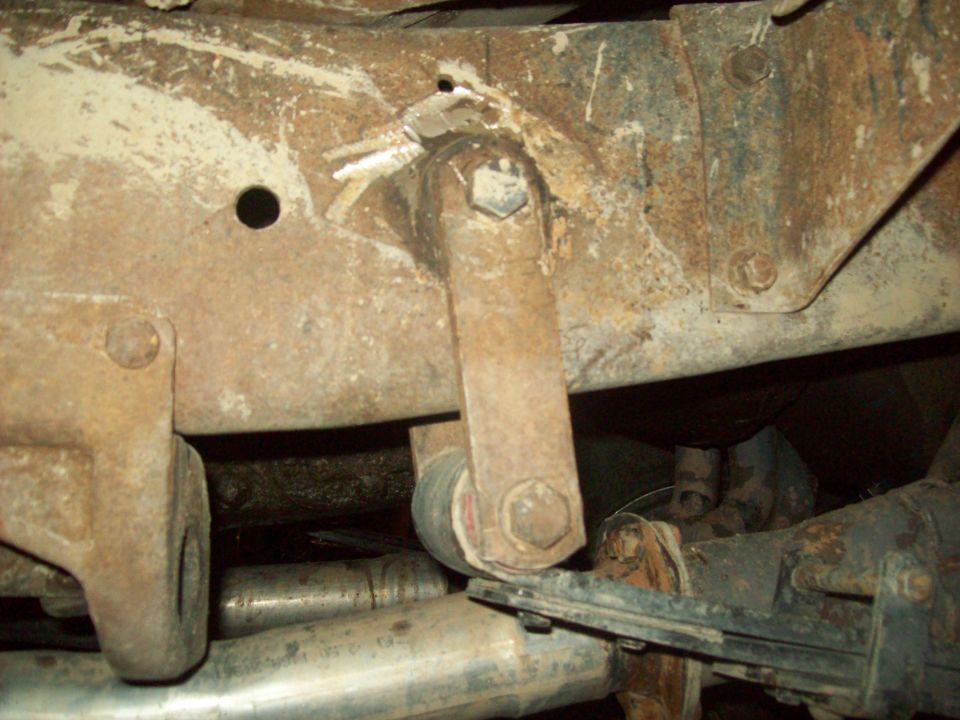 Underbody suspension linkage and rusty frame