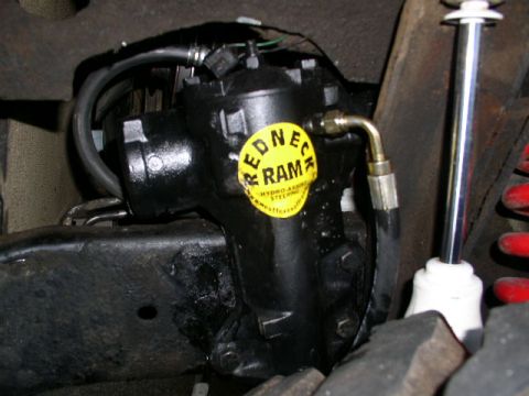 1979 Ford Bronco - This is a close-up view of a power steering ram, identified by a "REDNECK RAM" sticker.