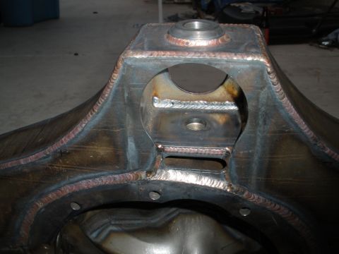 1995 Ford Bronco - Close-up of a fabricated rear axle housing, showing extensive welding and metalwork.