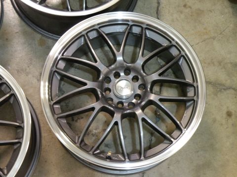 1998 Subaru Legacy - A single multi-spoke alloy wheel is shown, a polished lip and gunmetal spokes.