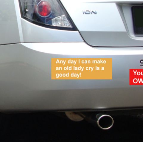 1971 Ford Ranchero - The rear of a silver car displays two bumper stickers, one with a humorous message and another partially obscured.