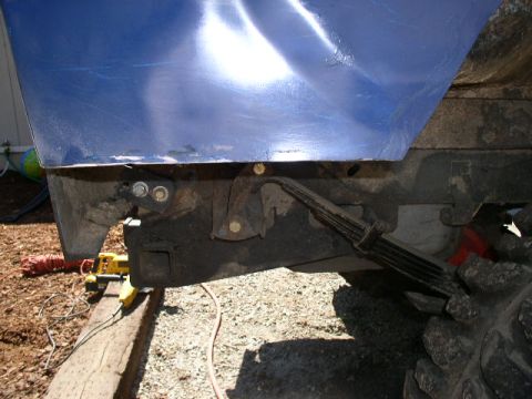 1979 Ford Bronco - The underside of a vehicle is shown, focusing on the suspension and frame components.