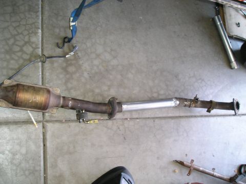1986 Toyota Hilux - Exhaust system with catalytic converter and a section of new pipe, likely for an engine swap.