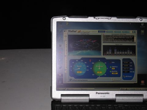 2001 Ford Crown Victoria - Laptop screen displays GPS tracking and navigation data.