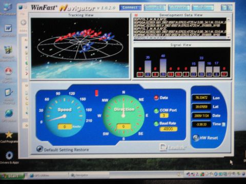 2001 Ford Crown Victoria - The WinFast Navigator software displays GPS data including speed, direction, and coordinates on a computer screen.