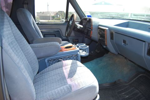 1991 Ford Bronco - Interior view of a 1991 Ford Bronco, showing the seats, dashboard, and center console.