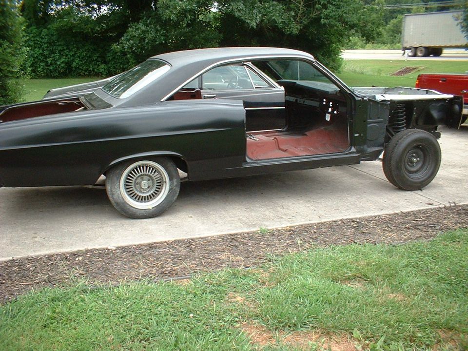 FINALLY !!!!! got the vinyl top, headliner, front & rear glass installed........ now we'll see how many years it takes the painter to do his thing.......  you've come a looong way, baby !!!!
