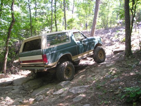 1989 Ford Bronco - This lifted Ford Bronco navigates a challenging off-road course, its capabilities.