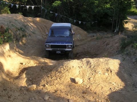 1989 Ford Bronco - This blue Ford Bronco navigates a challenging off-road course.