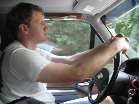 1978 Ford Bronco - Interior view of a man driving a vehicle.