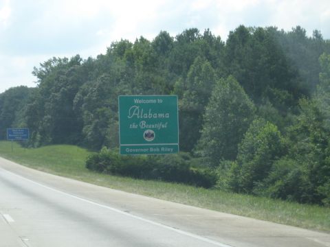 1978 Ford Bronco - Entering Alabama on the highway, passing a welcome sign.