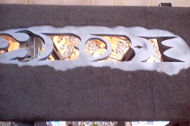 Custom speaker grille with flame cutouts, showing interior contents through openings