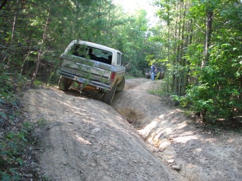 1978 Ford Bronco - This 1978 Ford Bronco navigates a challenging off-road trail, with another vehicle visible in the distance.