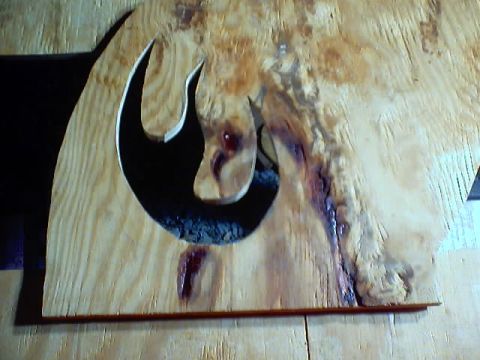1999 Ford Taurus - A wooden plaque displays a cut-out of the Rebel Alliance symbol against a dark background.