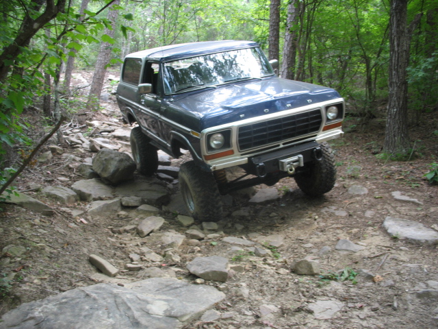 Blue 1978 Ford Bronco on a rocky trail