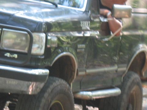 1978 Ford Bronco - This Ford F-Series truck has a 4x4 badge and chrome side step visible.