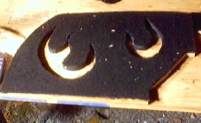 1999 Ford Taurus - A custom-cut black foam part, possibly for sound dampening or interior trim, with the Supermotors.net logo in the corner.