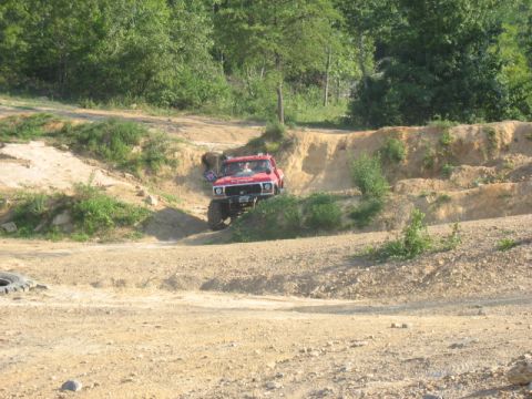1978 Ford Bronco - Red 1978 Ford Bronco navigating an off-road course.