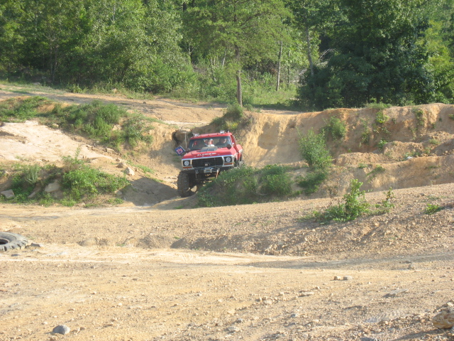 1978 Ford Bronco climbing a dirt hill off-road