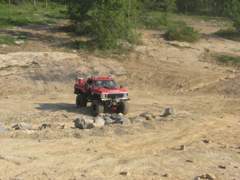 1978 Ford Bronco - This modified pickup truck navigates a rocky, off-road terrain.