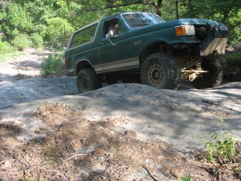 1978 Ford Bronco - Ford Bronco navigating rocky terrain during an off-road excursion.