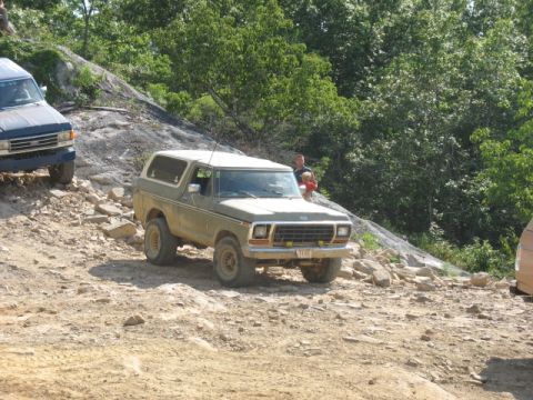 1978 Ford Bronco - A 1978 Ford Bronco navigates a challenging off-road trail with another vehicle visible.