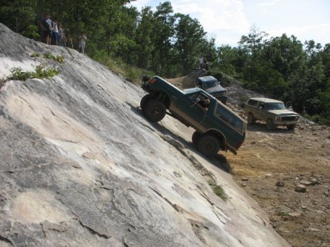 1978 Ford Bronco - An off-road enthusiast navigates a challenging rocky incline in a modified Ford Bronco.