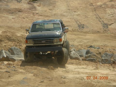 1991 Ford F-150 - This lifted 1991 Ford F-150 navigates a rocky off-road course.