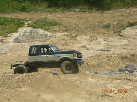 1991 Ford F-150 - This 1991 Ford F-150 chassis navigates a , rocky landscape, its off-road capabilities.