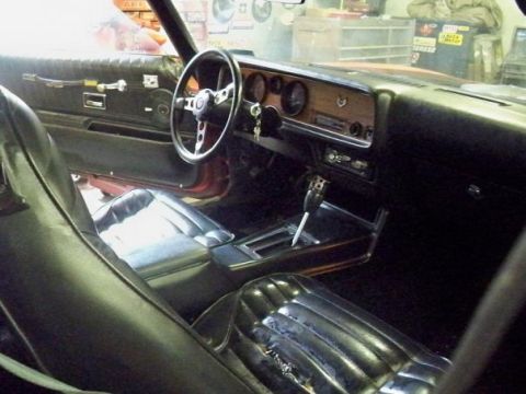 1974 Pontiac Firebird - Interior view of a 1974 Pontiac Firebird, highlighting the dashboard and seating.