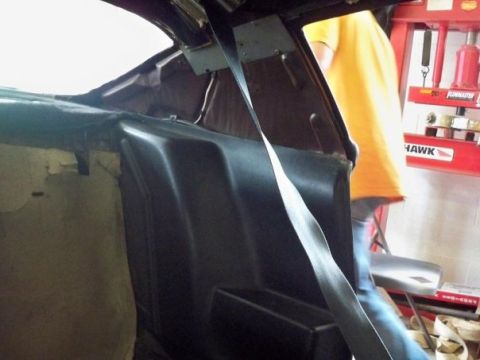 1974 Pontiac Firebird - The interior of a car, possibly from the 1970s, is shown with a seatbelt and black trim.