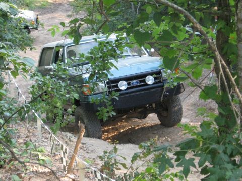 1978 Ford Bronco - This Ford Bronco is navigating a challenging off-road course with another vehicle following.