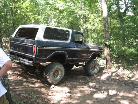 1978 Ford Bronco - This lifted 1978 Ford Bronco navigates a wooded off-road path.