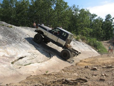 1978 Ford Bronco - This heavily modified off-road vehicle navigates a challenging rocky terrain.