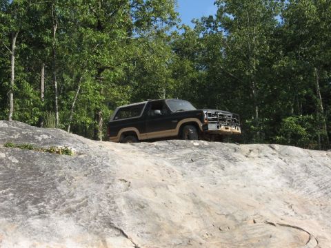 1978 Ford Bronco - 1978 Ford Bronco navigating a rocky trail.