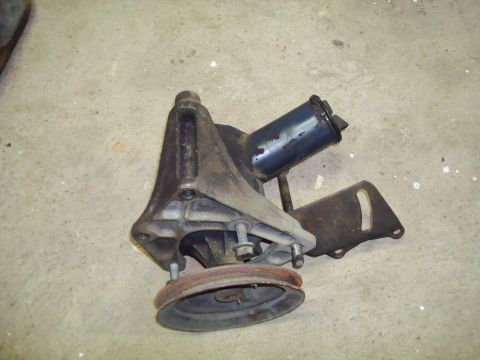 1995 Ford Bronco - This is a power steering pump assembly, likely for an older vehicle, shown with its pulley and bracket.