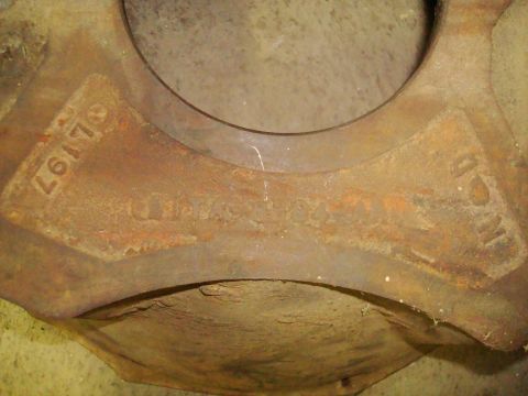 1995 Ford Bronco - A close-up view of a corroded metal component, showing stamped alphanumeric characters.